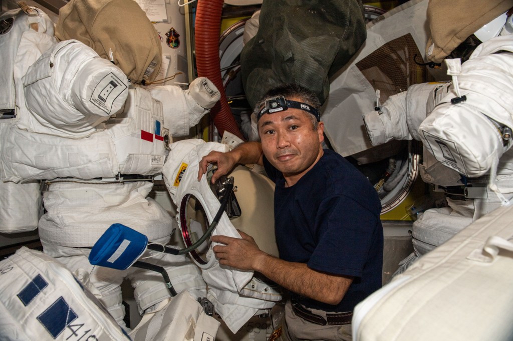 iss068e019667 (Oct. 27, 2022) --- Expedition 68 Flight Engineer Koichi Wakata of the Japan Aerospace Exploration Agency (JAXA) works on spacesuits, also known as Extra-vehicular Mobility Units (EMUs), located in the Quest airlock where spacewalks are staged in the U.S. segment of the International Space Station.