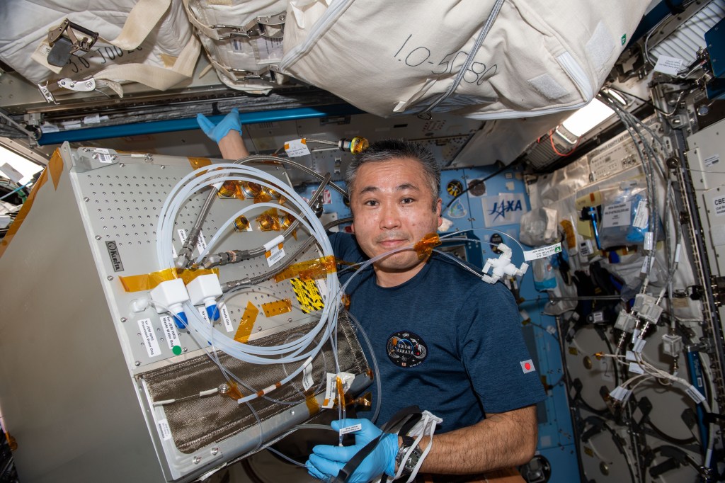 iss068e027924 (Dec. 8, 2022) --- Expedition 68 Flight Engineer Koichi Wakata of the Japan Aerospace Exploration Agency (JAXA) works on water recovery system components inside the International Space Station's Kibo laboratory module.