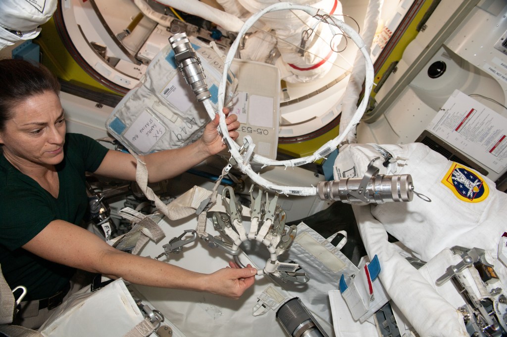 iss068e039915 (Jan. 11, 2023) --- NASA astronaut and Expedition 68 Flight Engineer Nicole Mann configures spacewalk tools and hardware inside the International Space Station's Destiny laboratory module.