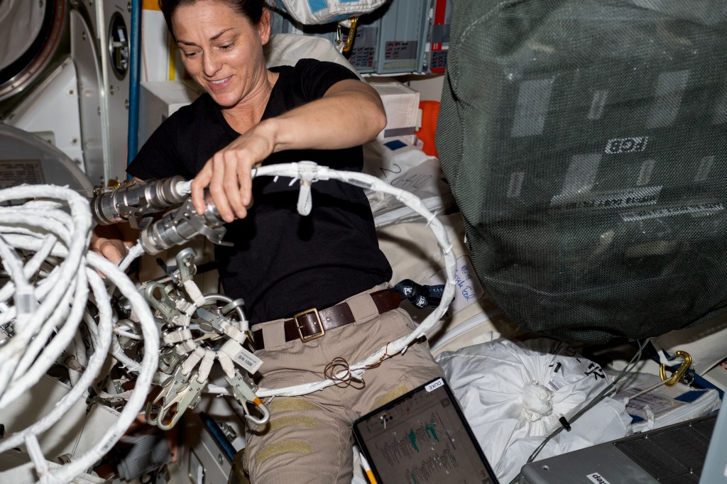 iss068e040900 (Jan. 19, 2023) --- NASA astronaut and Expedition 68 Flight Engineer Nicole Mann configures spacewalking hardware inside the International Space Station's Quest airlock.