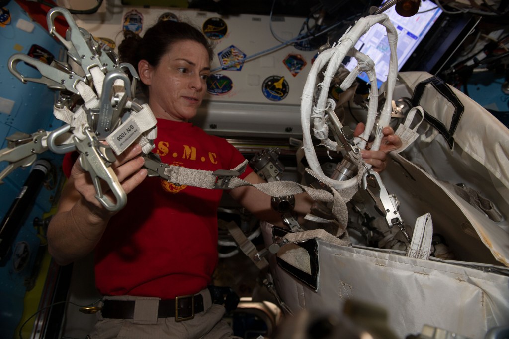 iss068e043086 (Jan. 27, 2023) --- NASA astronaut and Expedition 68 Flight Engineer Nicole Mann configures spacewalking hardware inside the International Space Station's Quest airlock.