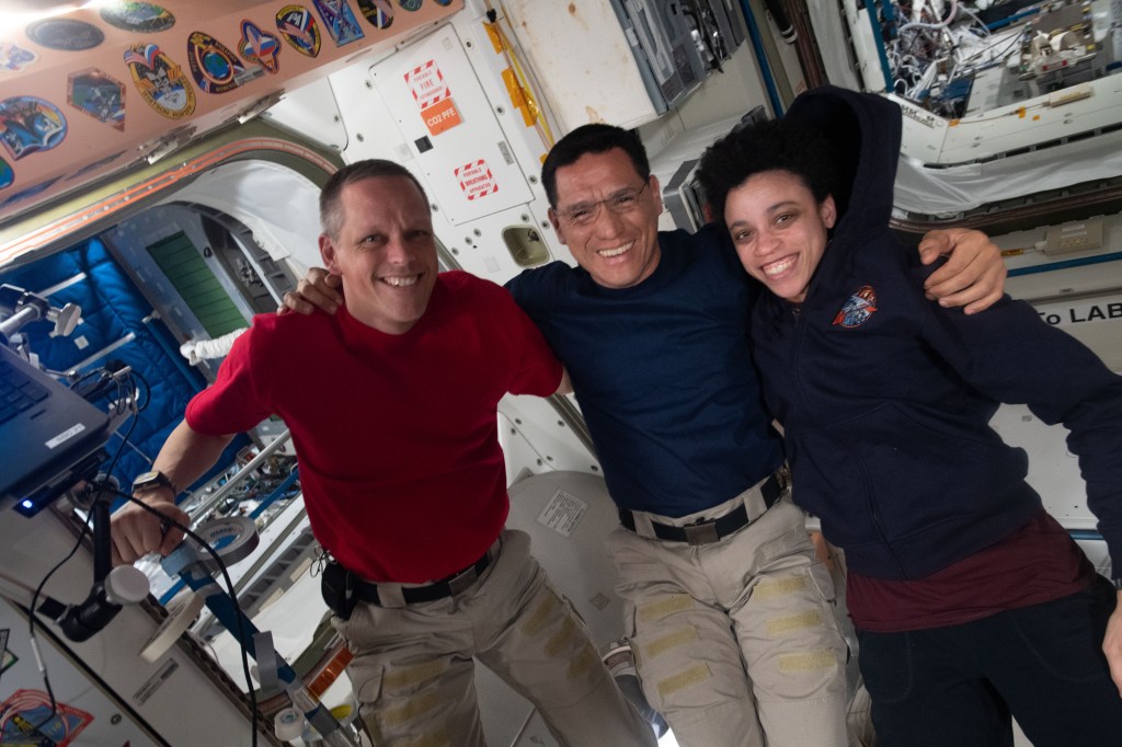 iss068e005834 (Sept. 30, 2022) --- Expedition 68 Flight Engineers (from left) Bob Hines, Frank Rubio, and Jessica Watkins, all three NASA astronauts, pose for a portrait together inside the the International Space Station's Unity module.