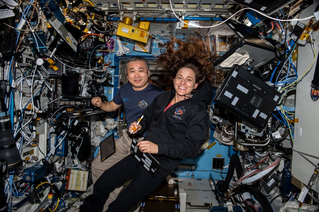 iss068e039507 (Jan. 10, 2023) --- Expedition 68 Flight Engineers Koichi Wakata of the Japan Aerospace Exploration Agency (JAXA) and Nicole Mann of NASA are pictured inside the International Space Station's Destiny laboratory module.