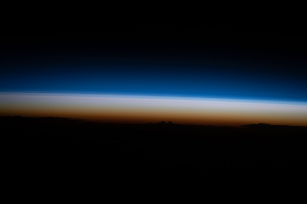 iss068e039886 (Jan. 10, 2023) --- An illuminated Earth's atmosphere begins dimming just after an orbital sunset in this photograph from the International Space Station as it soared 259 miles above the Pacific Ocean near Japan.