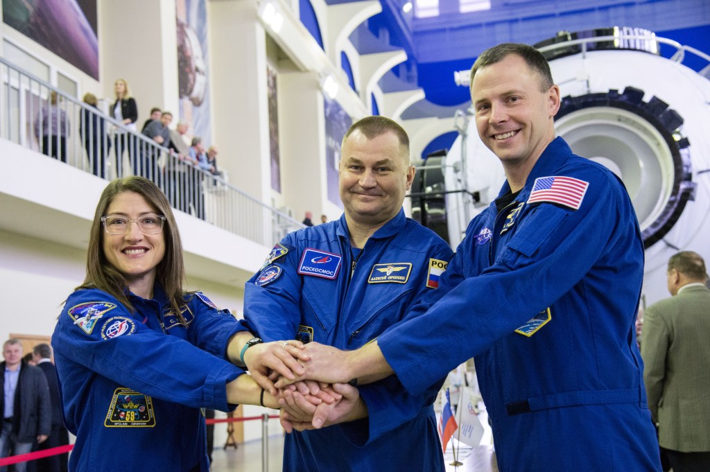 At the Gagarin Cosmonaut Training Center in Star City, Russia, Expedition 59 crew members Christina Koch of NASA (left), Alexey Ovchinin of Roscosmos (center) and Nick Hague of NASA (right) pose for pictures Feb. 19 during the first of two days of final pre-launch qualification exams. They will launch March 14, U.S. time, from the Baikonur Cosmodrome in Kazakhstan on the Soyuz MS-12 spacecraft for a six-and-a-half month mission on the International Space Station.