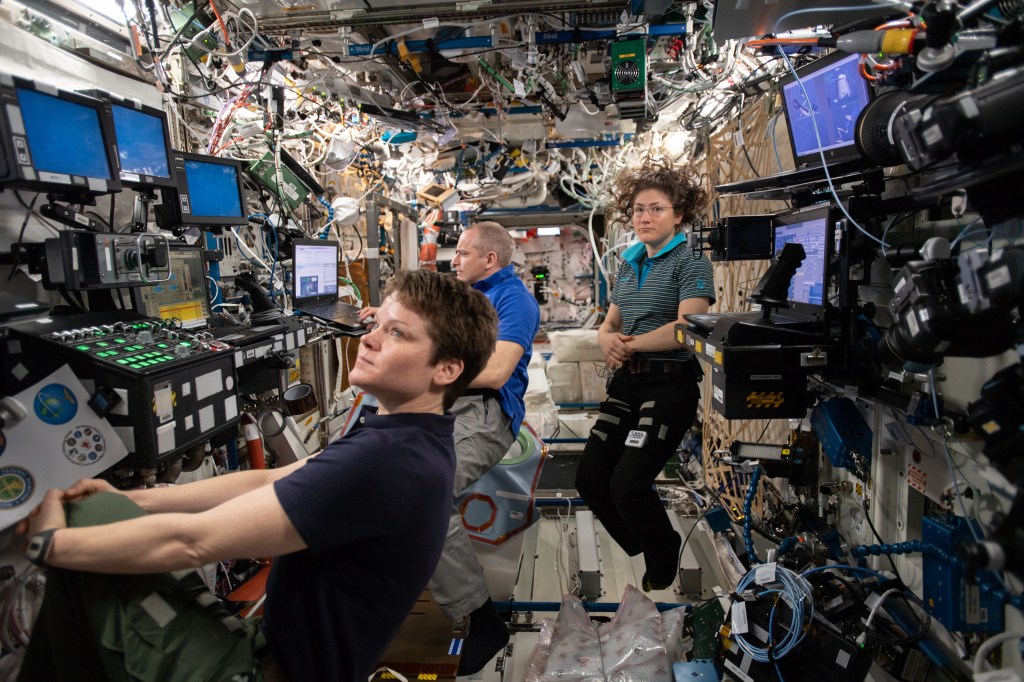 Expedition 59 Flight Engineers (from left) Anne McClain, David Saint-Jacques and Christina Koch are gathered inside the U.S. Destiny laboratory.