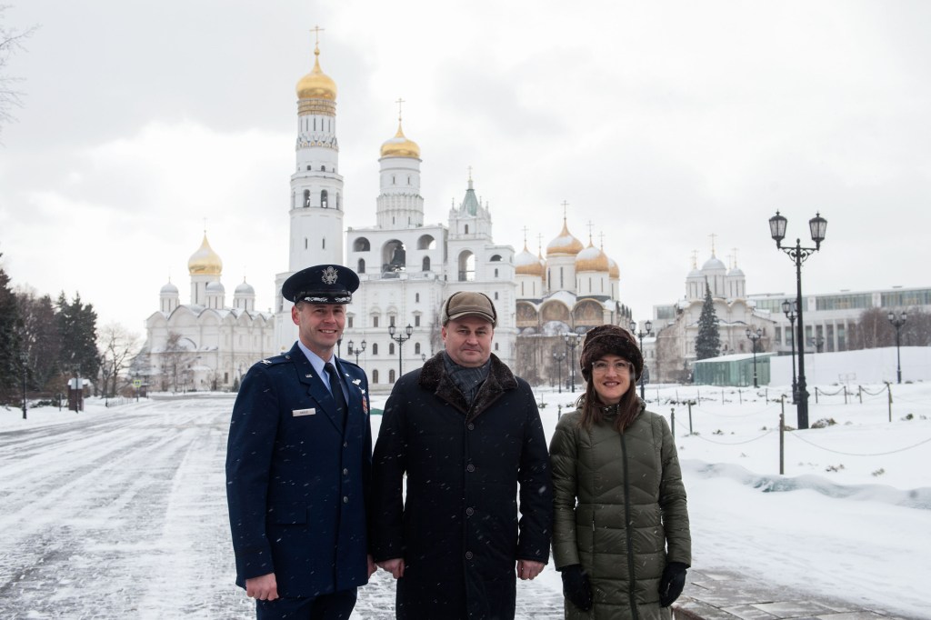 Inside the Kremlin in Moscow, Expedition 59 crew members Nick Hague of NASA (left), Alexey Ovchinin of Roscosmos (center) and Christina Koch of NASA (right) pose for pictures on a wintry day Feb. 21 as part of their pre-launch activities. They will launch March 14, U.S. time, on the Soyuz MS-12 spacecraft from the Baikonur Cosmodrome in Kazakhstan for a six-and-a-half month mission on the International Space Station.