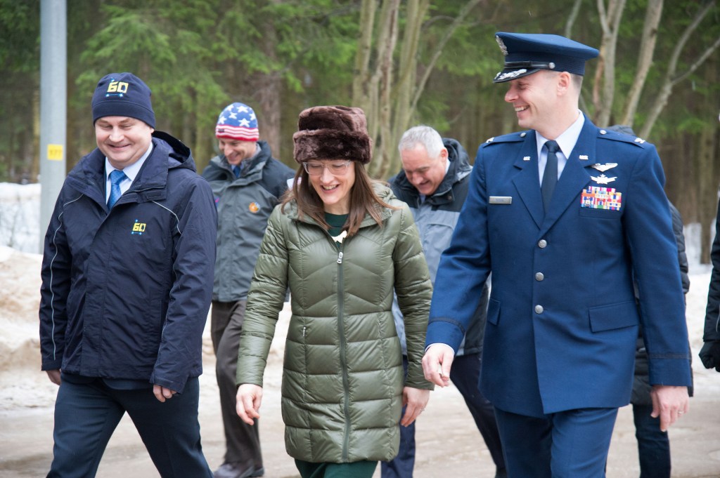 At the Gagarin Cosmonaut Training Center in Star City, Russia, Expedition 59 crew members Alexey Ovchinin of Roscosmos (left), Christina Koch of NASA (center) and Nick Hague of NASA (right) walk to a bus Feb. 26 to take them to their plane for a flight to their launch site at the Baikonur Cosmodrome in Kazakhstan for final pre-launch training. They will launch on March 14, U.S. time, on the Soyuz MS-12 spacecraft from the Baikonur Cosmodrome in Kazakhstan for a six-and-a-half month mission on the International Space Station.