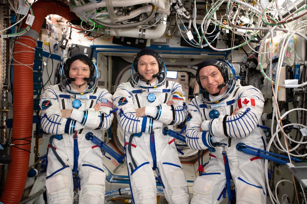 Expedition 59 crew members (from left) Anne McClain, Oleg Kononenko and David Saint-Jacques are wearing the Sokol launch and entry suits they will wear on the way back to Earth aboard the Soyuz MS-11 crew ship.