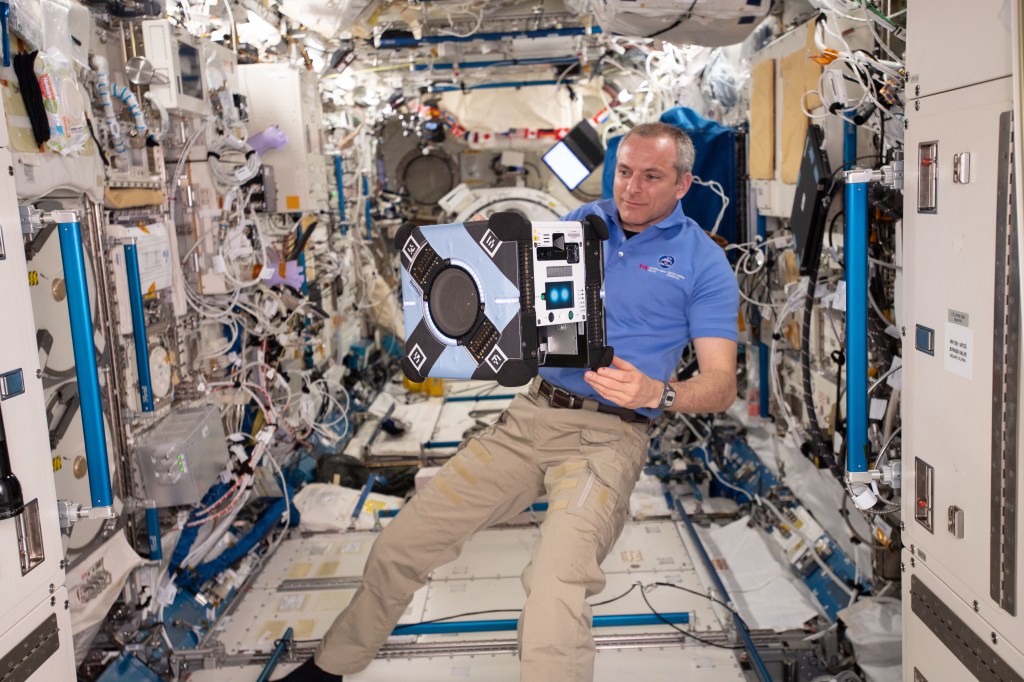 Expedition 59 Flight Engineer David Saint-Jacques of the Canadian Space Agency prepares the free-flying Astrobee robotic assistant for a mobility test inside the Kibo laboratory module. Astrobee consists of three self-contained, free flying robots and a docking station inside the International Space Station.