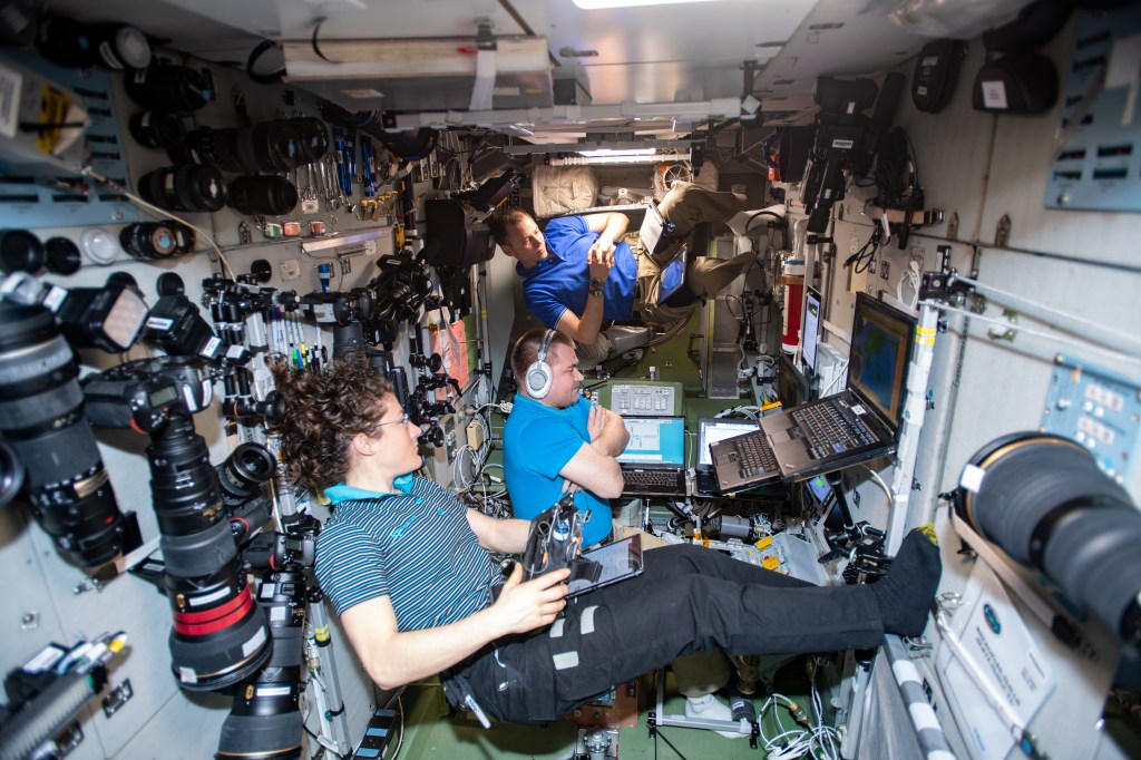 Flight Engineers (front to back) Christina Koch of NASA, Alexey Ovchinin of Roscosmos and Nick Hague of NASA conduct an emergency simulation where they practice quickly entering their Soyuz lifeboat, undocking from the International Space Station and descending to Earth.