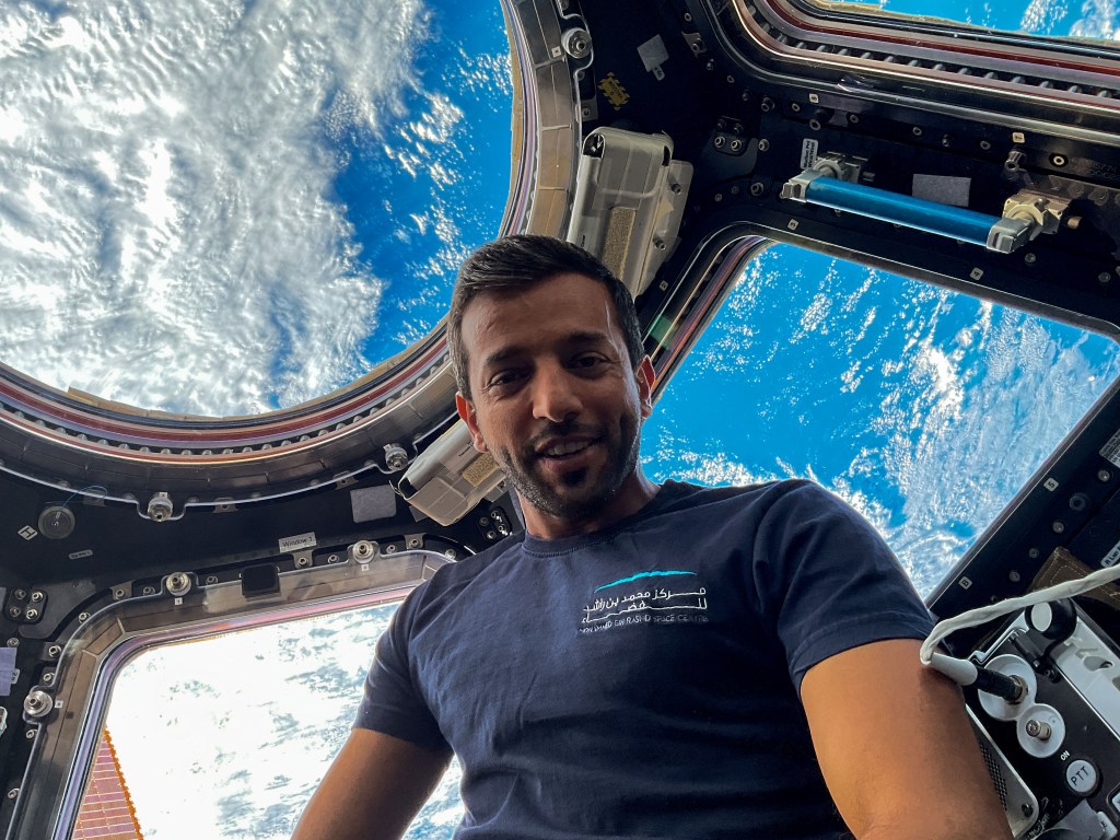 iss068e071325 (March 5, 2021) --- UAE (United Arab Emirates) astronaut and Expedition 68 Flight Engineer Sultan Alneyadi is pictured inside the seven-window cupola, the International Space Station's "window to the world." The orbiting lab was flying 260 milers above the Philippine Sea at the time of this photograph.