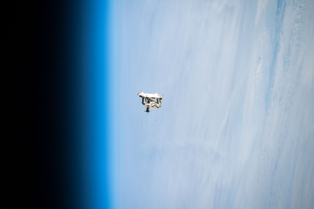 iss068e044261 (Jan. 31, 2023) --- Flight support equipment is pictured descending toward the Earth's atmosphere after being jettisoned from the grips of the Canadarm2 robotic arm. The flight hardware secured a pair of roll-out solar arrays inside SpaceX Dragon cargo ship’s trunk during its ascent to orbit and rendezvous with the International Space Station in November 2022. The jettisoned support equipment drifted safely away from the station and will eventually harmlessly burn up in the atmosphere with no chance for recontacting the space station.