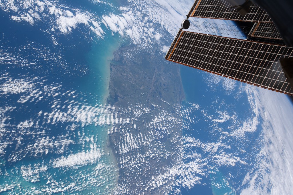 iss059e027945 (April 20, 2019) --- The state of Florida, with the Gulf of Mexico on its west coast, the Atlantic Ocean on its east coast and the International Space Station's solar arrays in the foreground are pictured as the orbital complex flew 254 miles above Earth's surface.