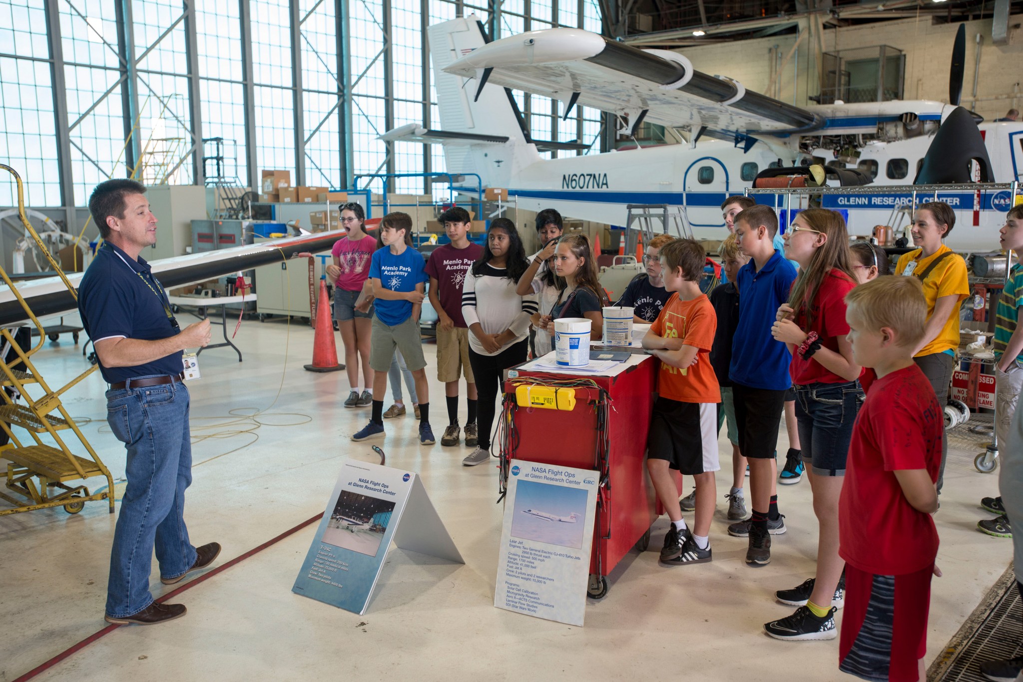 NASA Glenn Pilot conducting a Flight Research Facility tour with students during Aviation Day
