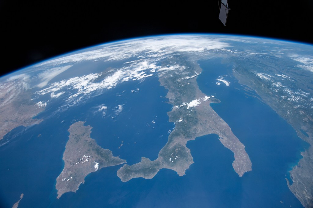 The International Space Station was orbiting 255 miles above the Mediterranean Sea when an Expedition 59 crewmember looking northwest took this photograph of Italy and its island Sicily.
