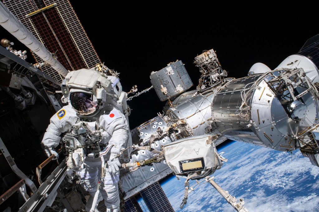 iss068e045147 (Feb. 2, 2023) --- Expedition 68 Flight Engineer Koichi Wakata of the Japan Aerospace Exploration Agency (JAXA) is pictured in his Extravehicular Mobility Unit, or spacesuit, during his second spacewalk. He and fellow spacewalker Nicole Mann (out of frame) of NASA installed a modification kit on the International Space Station's starboard truss structure that will enable the future installation of the orbiting lab's next roll-out solar array.