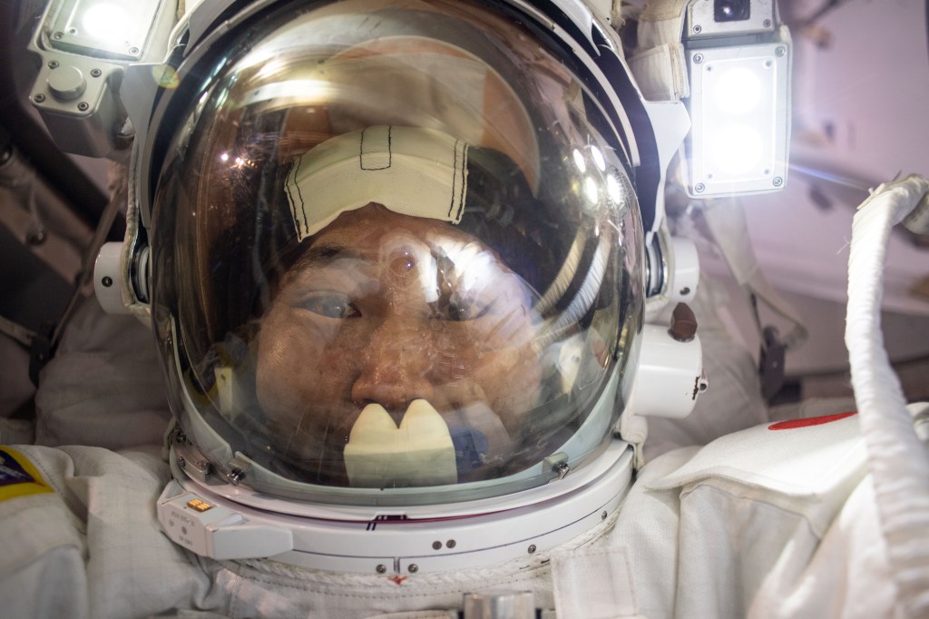 iss068e045253 (Feb. 2, 2023) --- Expedition 68 Flight Engineer Koichi Wakata of the Japan Aerospace Exploration Agency (JAXA) points the camera toward himself and takes a "space-selfie" with his helmet's visor up during a six-hour and 41-minute spacewalk. He and fellow spacewalker Nicole Mann (out of frame) of NASA installed a modification kit on the International Space Station's starboard truss structure preparing the orbital lab for its next roll-out solar array.