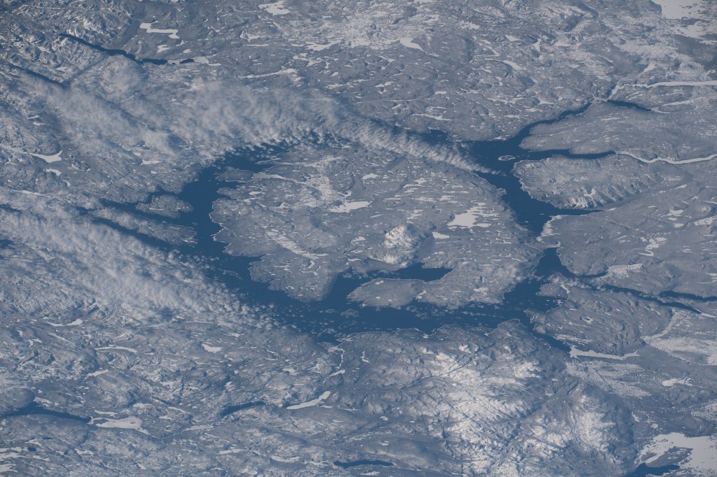iss068e028530 (Dec. 10, 2022) --- Lake Manicouagan, formed by a meteoroid impact about 214 million years ago, in Quebec, Canada, is pictured from the International Space Station as it orbited 262 miles above North America.