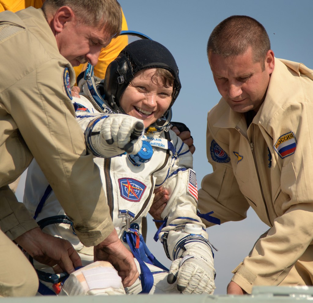 Expedition 59 NASA astronaut Anne McClain is helped out of the Soyuz MS-11 spacecraft just minutes after she, Canadian Space Agency astronaut David Saint-Jacques, and Roscosmos cosmonaut Oleg Kononenko, landed in a remote area near the town of Zhezkazgan, Kazakhstan on Tuesday, June 25, 2019 Kazakh time (June 24 Eastern time). McClain, Saint-Jacques, and Kononenko are returning after 204 days in space where they served as members of the Expedition 58 and 59 crews onboard the International Space Station.
