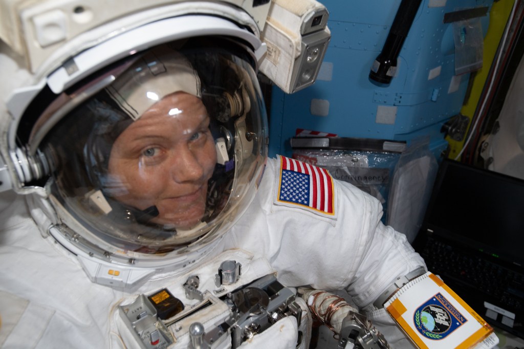 NASA astronaut Anne McClain is suited up in the U.S. Quest airlock preparing to begin what would be a six-and-a-half hour spacewalk with astronaut David Saint-Jacques (out of frame) of the Canadian Space Agency. The two spacewalkers established a redundant path of power to the Canadian-built robotic arm, known as Canadarm2, and installed cables to provide for more expansive wireless communications.