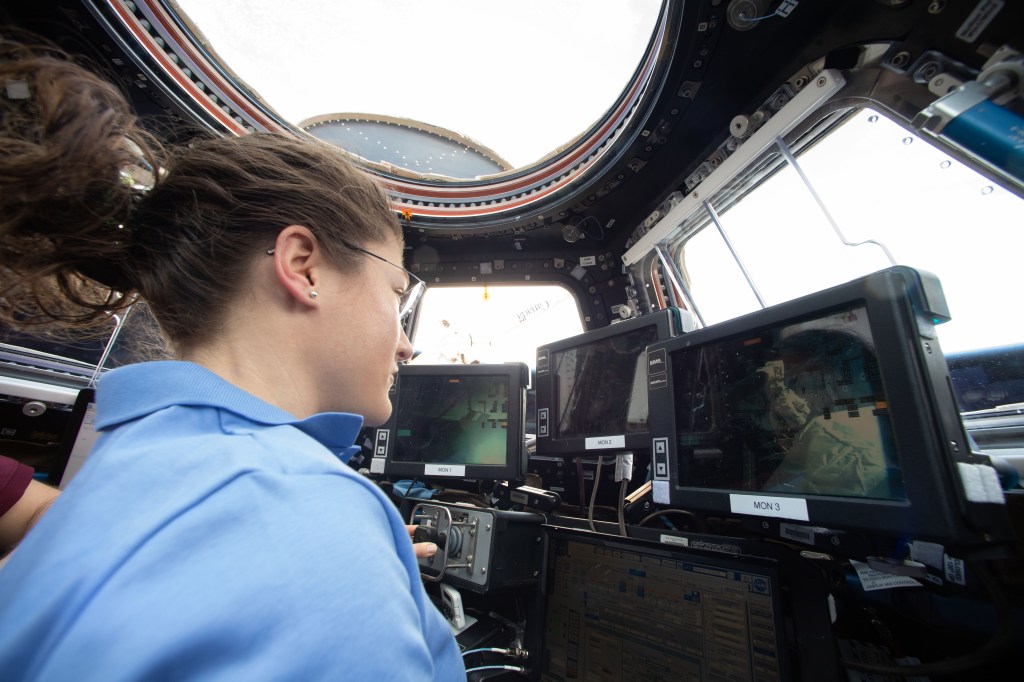NASA astronaut Christina Koch is inside the cupola practicing Canadarm2 robotics maneuvers and Cygnus spacecraft capture techniques.