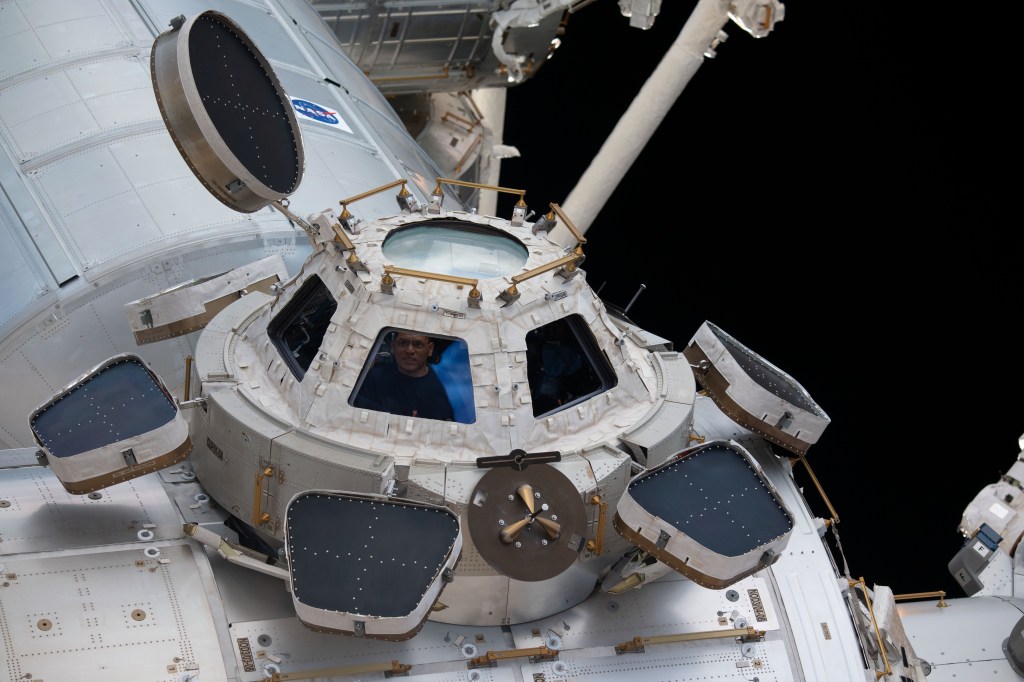 iss068e036064 (Jan. 2, 2023) --- NASA astronaut and Expedition 68 Flight Engineer Frank Rubio peers through one of the seven windows in the cupola, the International Space Station's "window to the world."