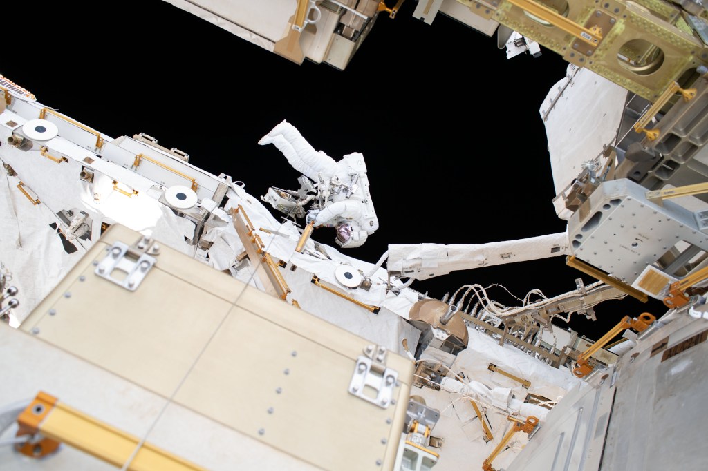 NASA astronaut Nick Hague is tethered to the International Space Station during a six-hour, 39-minute spacewalk to upgrade the orbital complex's power storage capacity.