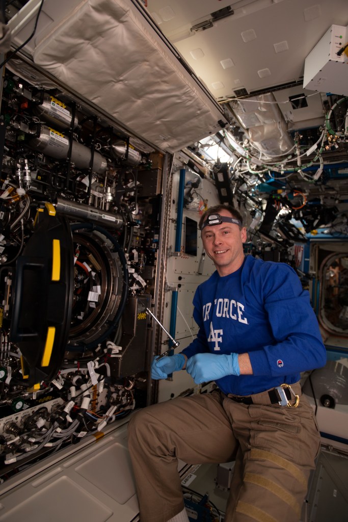 NASA astronaut Nick Hague replaces hardware inside the Combustion Integrated Rack supporting the Advanced Combustion via Microgravity Experiments (ACME). ACME is a set of five independent studies researching improved fuel efficiency and reduced pollutant production in practical combustion on Earth, as well as spacecraft fire prevention through innovative research focused on materials flammability.