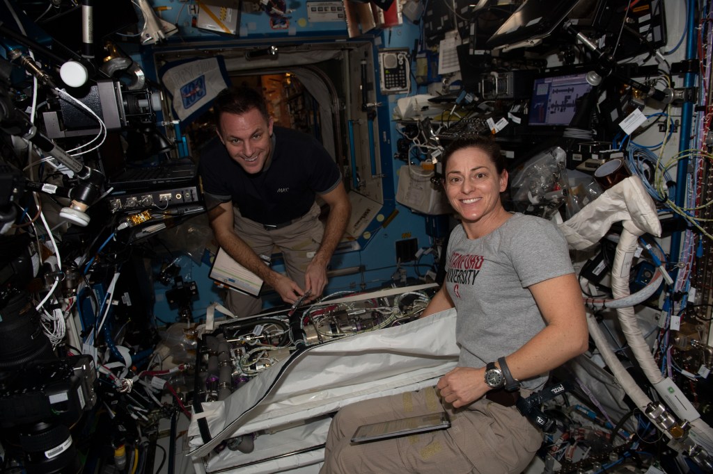 iss068e051639 (Feb. 13, 2023) --- Expedition 68 Flight Engineers Josh Cassada and Nicole Mann, both from NASA, are pictured during life support maintenance aboard the International Space Station's Destiny laboratory module.