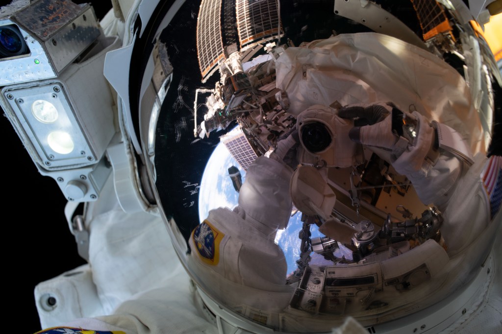 iss068e022442 (Nov. 15, 2022) --- NASA astronaut and Expedition 68 Flight Engineer Frank Rubio points his camera toward himself and takes an out-of-this-world "space-selfie" with his helmet visor's reflective shield down during a spacewalk in his Extravehicular Mobility Unit, or spacesuit.