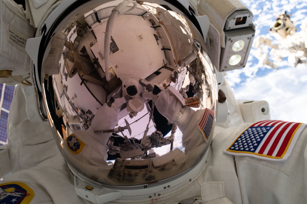NASA astronaut Nick Hague takes an out-of-this-world "space-selfie" 250 miles above Earth during a spacewalk to upgrade the International Space Station's power storage capacity. This was Hague's and NASA astronaut Anne McClain's (out of frame) first spacewalk.