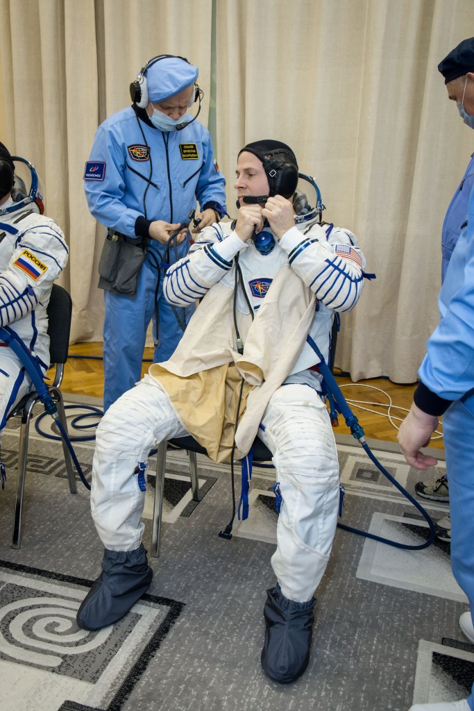 At the Baikonur Cosmodrome in Kazakhstan, Expedition 59 crew member Nick Hague of NASA suits up for a Soyuz fit check dress rehearsal Feb. 27 during pre-launch training. Hague, Christina Koch of NASA and Alexey Ovchinin of Roscosmos will launch March 14, U.S. time, on the Soyuz MS-12 spacecraft from the Baikonur Cosmodrome in Kazakhstan for a six-and-a-half month mission on the International Space Station.