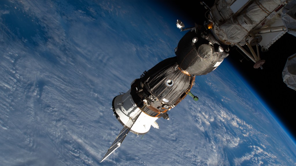 Russia's Soyuz MS-12 crew ship is pictured docked to the International Space Station's Rassvet module as the orbital complex flew 258 miles above the North Sea off the coast of the Netherlands.