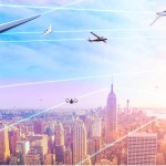 City scape of New York City at sunrise with multiple airplanes and other flying vehicles