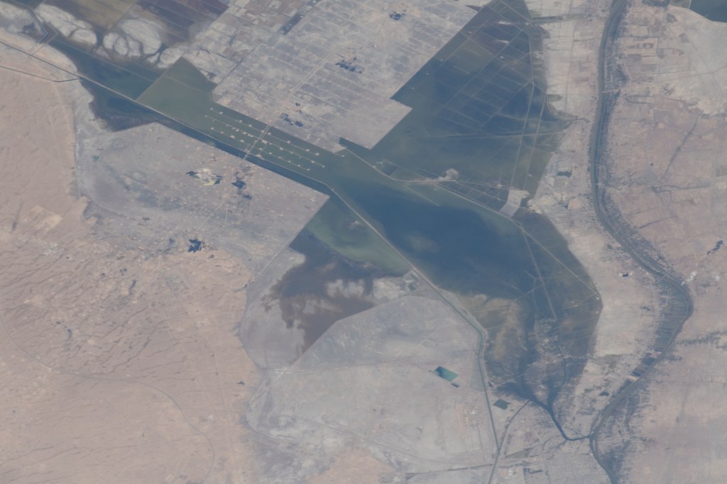 Severe flooding is seen near Basrah, Iraq, as unusually heavy and persistent rain doused several Middle Eastern countries in late March and early April 2019. At the same time, mountains were beginning to lose their snow cover to melting.