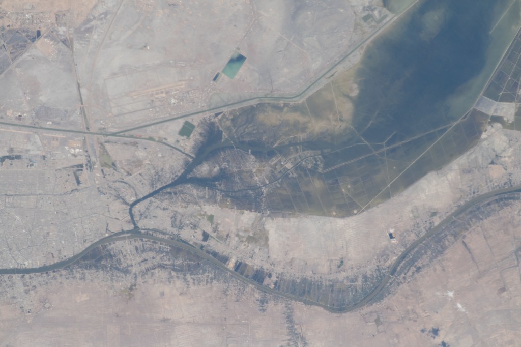 Severe flooding is seen near Basrah, Iraq, as unusually heavy and persistent rain doused several Middle Eastern countries in late March and early April 2019. At the same time, mountains were beginning to lose their snow cover to melting.