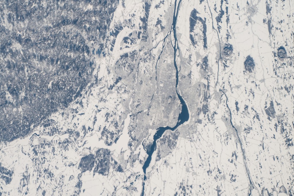 iss068e044249 (Jan. 31, 2023) --- Snow-covered Montreal in the Canadian province of Quebec, in between the Prairies River and the St. Lawrence River, is pictured from the International Space Station as it orbited 262 miles above the Atlantic coast of Maine.