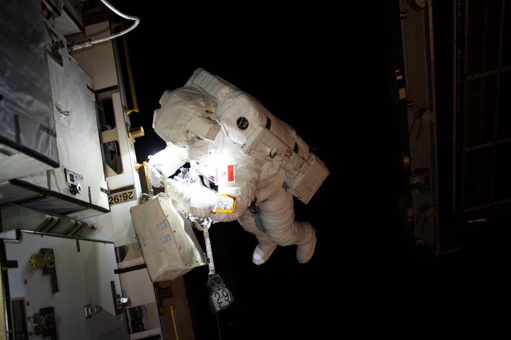 Expedition 59 Flight Engineer David Saint-Jacques of the Canadian Space Agency is seen working to relocate a battery adapter plate outside the International Space Station. In a six and a half hour spacewalk, Saint-Jacques and NASA astronaut Anne McClain successfully established a redundant path of power to the Canadian-built robotic arm, known as Canadarm2, and installed cables to provide for more expansive wireless communications coverage outside the orbital complex, as well as for enhanced hardwired computer network capability. The duo also relocated an adapter plate from the first spacewalk in preparation for future battery upgrade operations.