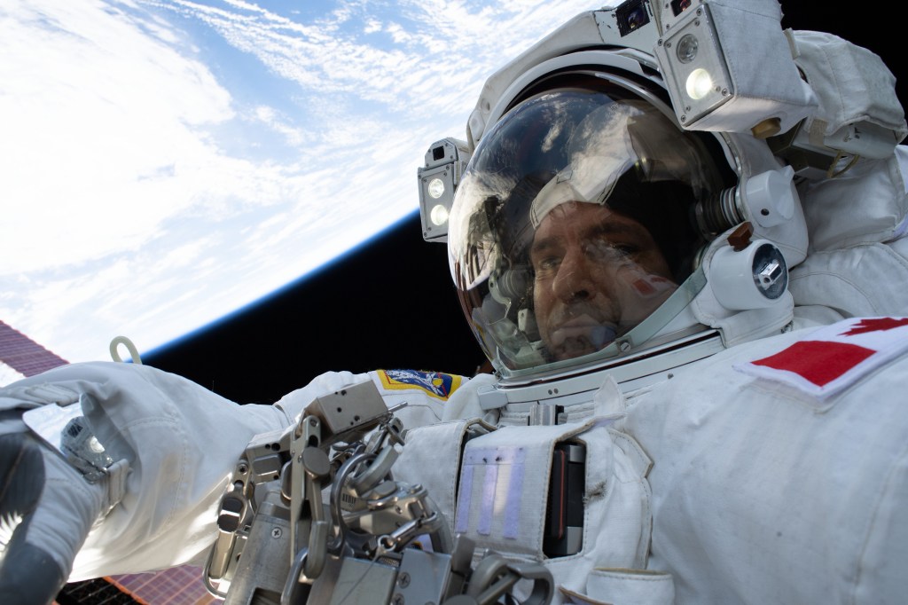 Expedition 59 Flight Engineer David Saint-Jacques of the Canadian Space Agency participates in a six-and-a-half hour spacewalk with NASA astronaut Anne McClain (out of frame). The spacewalkers successfully established a redundant path of power to the Canadian-built robotic arm, known as Canadarm2, and installed cables to provide for more expansive wireless communications coverage outside the orbital complex, as well as for enhanced hardwired computer network capability. The duo also relocated an adapter plate from the first spacewalk in preparation for future battery upgrade operations.