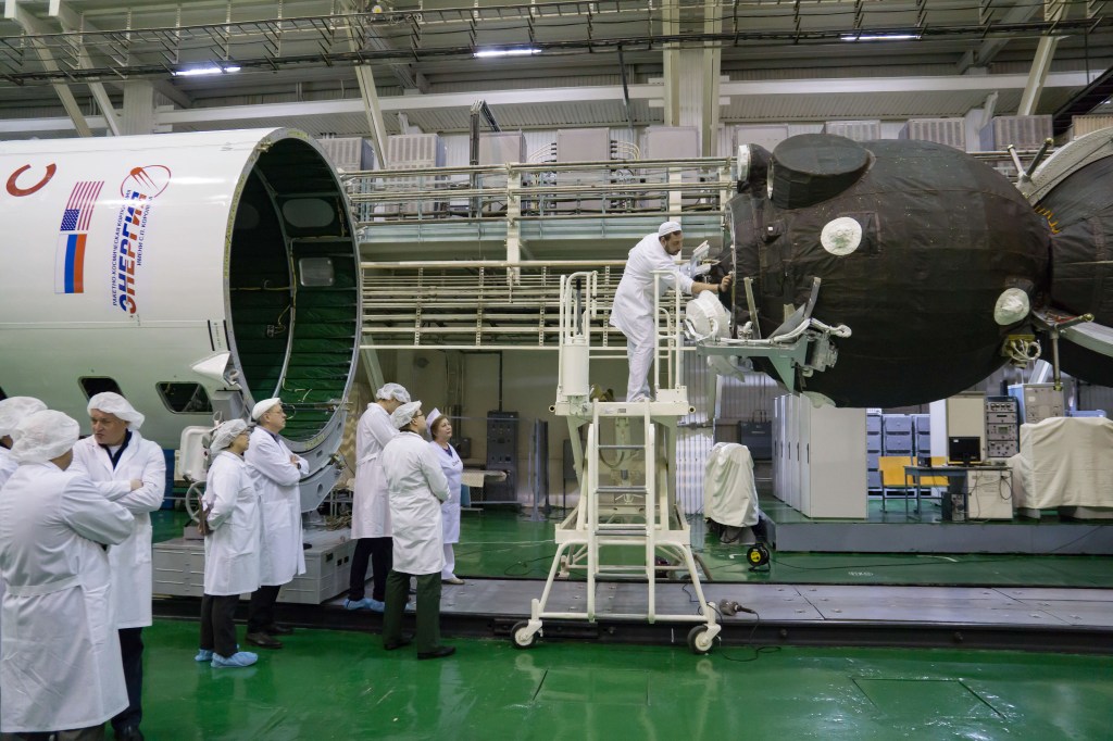 In the Integration Building at the Baikonur Cosmodrome in Kazakhstan, technicians check of the alignment of the Soyuz MS-12 spacecraft (right) with its Soyuz booster’s nose fairing (left) March 6 prior to its encapsulation into the Soyuz booster rocket. Expedition 59 crew members Nick Hague and Christina Koch of NASA and Alexey Ovchinin of Roscosmos will launch on March 14, U.S. time, on the Soyuz MS-12 spacecraft from the Baikonur Cosmodrome for a six-and-a-half month mission on the International Space Station.