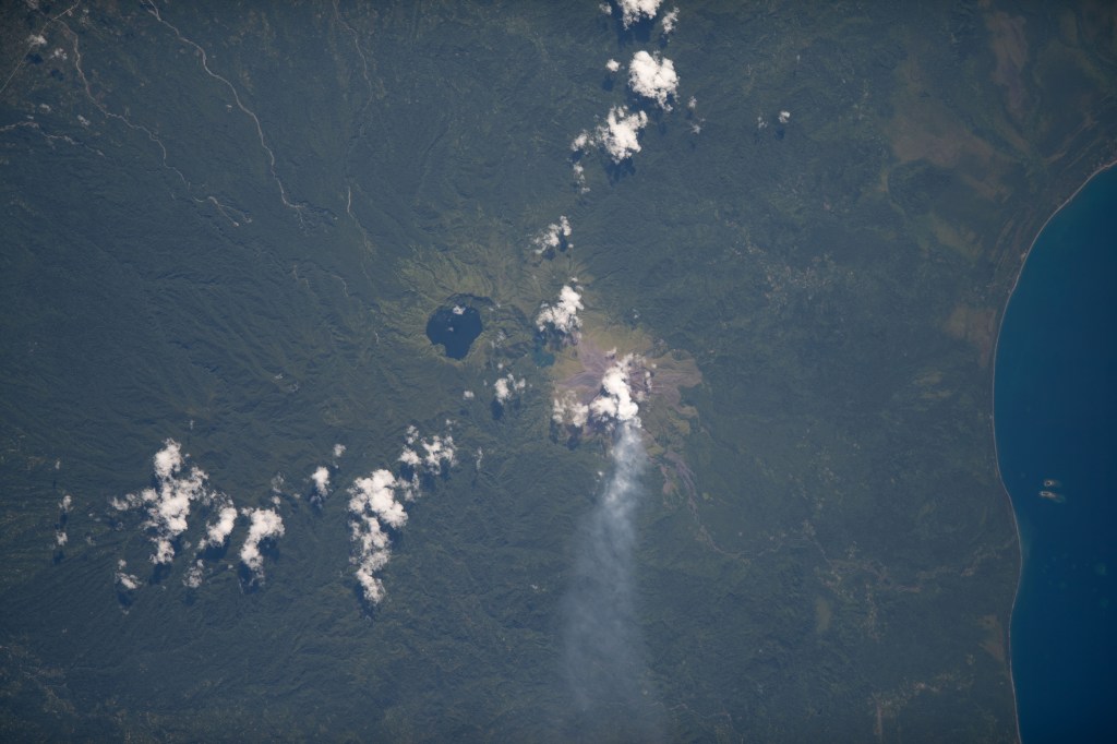 iss068e007429 (Oct. 2, 2022) --- Billy Mitchell Crater Lake and the active volcano Bagana on Papua New Guinea's Bougainville Island are pictured from the International Space Station as it orbited 260 miles above the southwestern Pacific Ocean. Credit: ESA/Samantha Cristoforetti
