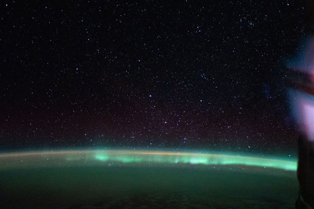The aurora australis, or "southern lights," highlights a starry nighttime orbital pass as the International Space Station orbited 269 miles above the Indian Ocean southwest of Australia.