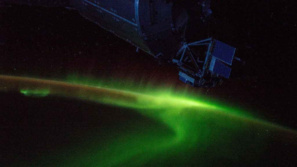 The aurora australis swirls above the Indian Ocean south of Australia as the International Space Station orbited 265 miles over Earth. A portion of the dimly-lit Columbus laboratory module from ESA (European Space Agency) is seen in the top foreground.