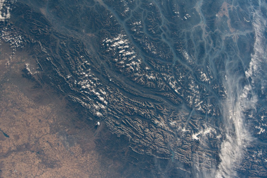 iss068e011272 (Oct. 1, 2022) --- The Canadian Rockies in the Canadian provinces of British Columbia and Alberta are pictured from the International Space Station as it orbited 262 miles above North America. Credit: NASA/Bob Hines