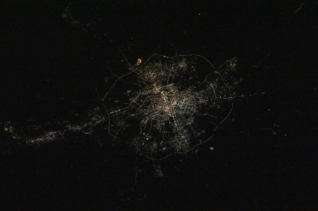 iss068e024160 (Nov. 25, 2022) --- The city lights of Shenyang, China, are pictured from the International Space Station as it orbited 258 miles above the Yellow Sea.