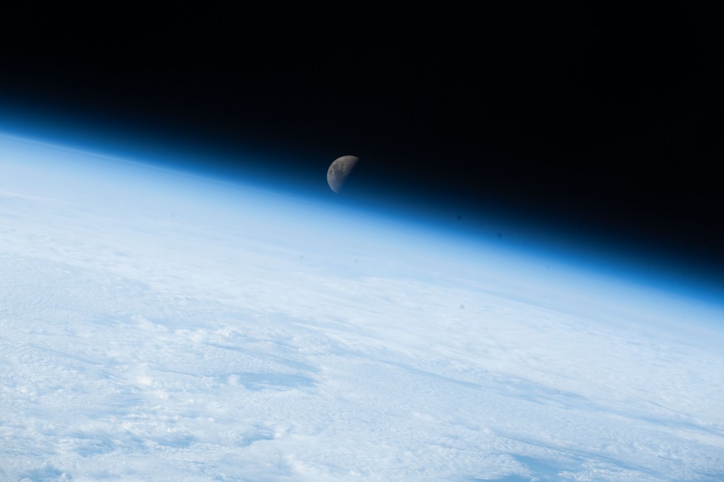 iss068e007324 (Oct. 2, 2022) --- The first quarter Moon is pictured setting below Earth's horizon as the International Space Station orbited 267 miles above the Indian Ocean west of Australia's island state of Tasmania. Credit: ESA/Samantha Cristoforetti