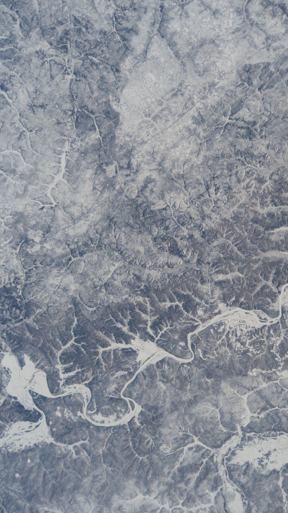 iss068e047351 (Feb. 8, 2023) --- The frozen Amur River forms the border between northeastern China and far eastern Russia in this wintry photograph taken from the International Space Station as it orbited 265 miles above.