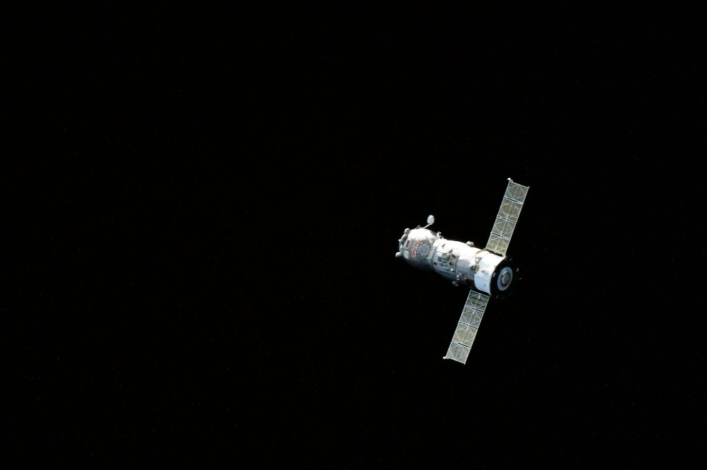 iss068e055642 (Feb. 18, 2023) --- The ISS Progress 82 cargo craft is pictured departing the vicinity of the International Space Station after undocking from the Poisk module ending a four-month resupply mission.
