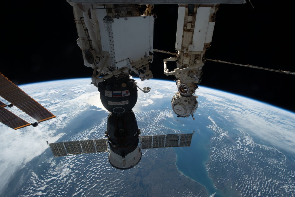 iss068e014600 (Oct. 8, 2022) --- The Soyuz MS-22 crew ship is pictured in the foreground docked to the Rassvet module as the International Space Station orbited 264 miles above Europe. In the background, is the Prichal docking module attached to the Nauka multipurpose laboratory module.